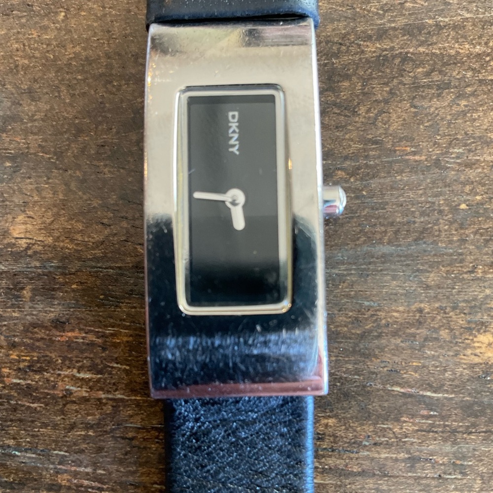 Black leather DKNY Watch. Needs battery